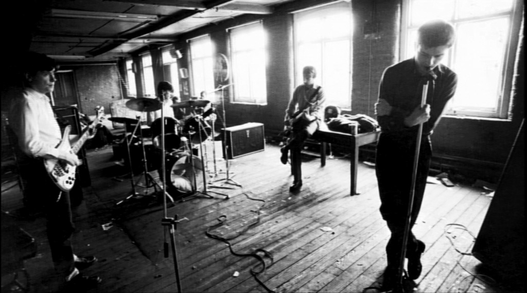 Joy Division filming the music video for "Love Will Tear Us Apart," 1980.